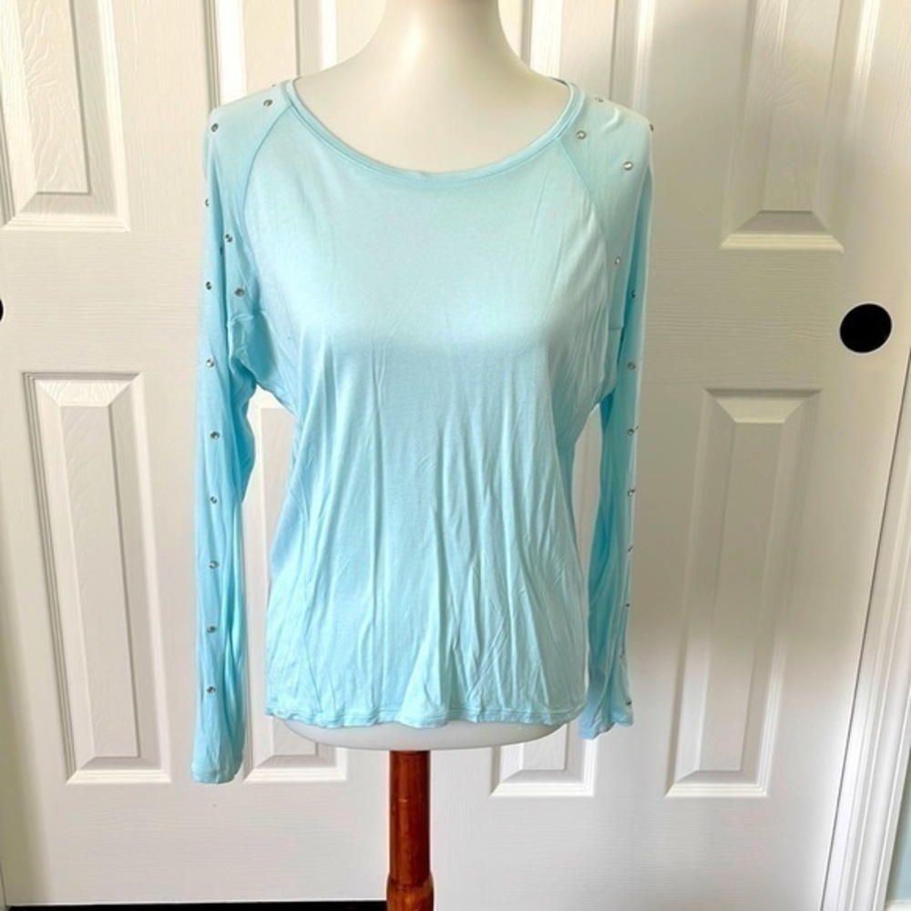 Jennifer Lopez long sleeve sky blue shirt with rhinestones down both arms.